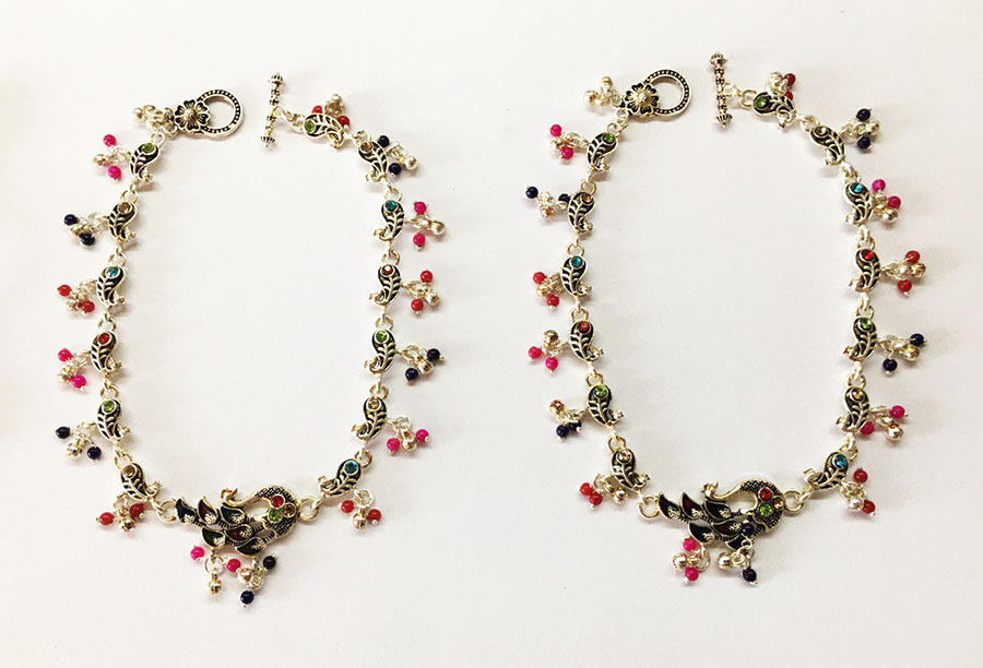 Прикраси на ноги з павичем