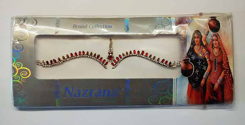 Індійські бінді. Над бровами з червоними камінцями