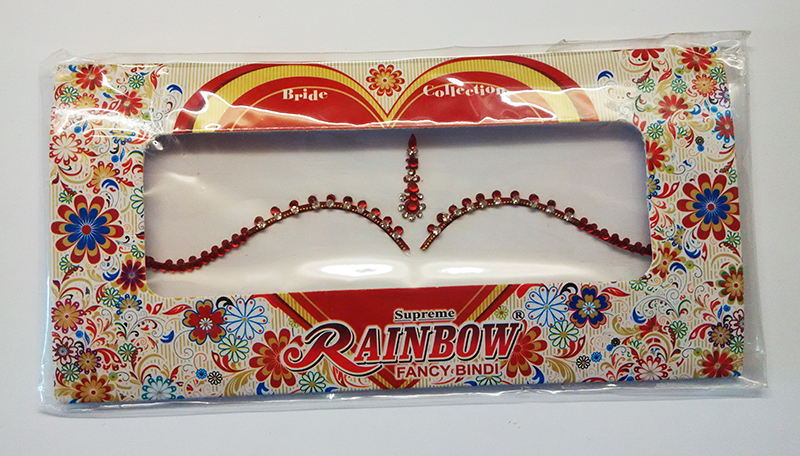 Червоні бінді (над бровами)